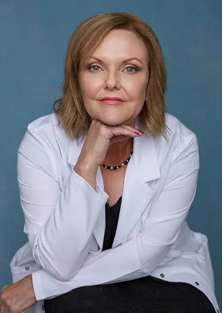 A woman in white shirt and black top